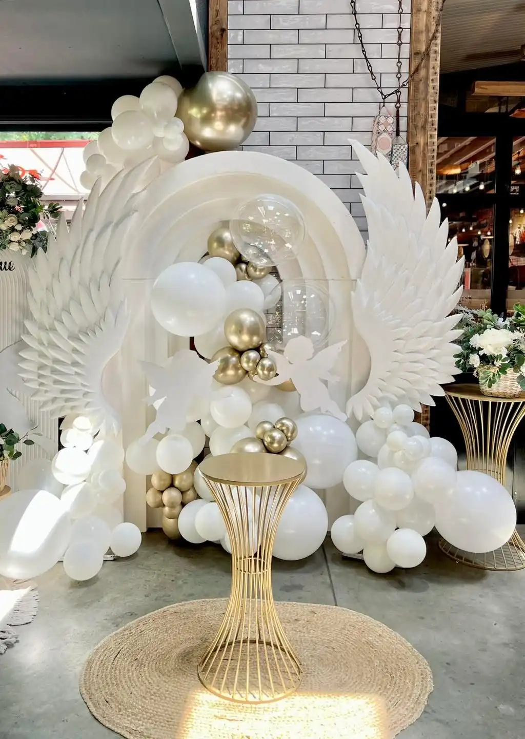 Christening decor with angel wings and balloon styling at Bubbu Bear in Plovdiv